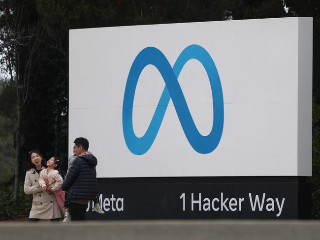 MENLO PARK, CALIFORNIA - JANUARY 29: Visitors take pictures by a sign posted in front of Meta headquarters on January 29, 2025 in Menlo Park, California. Meta will report fourth-quarter earnings today after the closing bell.   Justin Sullivan/Getty Images/AFP (Photo by JUSTIN SULLIVAN / GETTY IMAGES NORTH AMERICA / Getty Images via AFP)