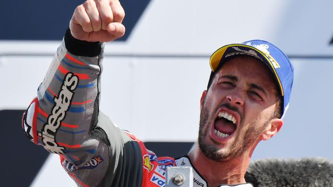 Ducati Team's Italian rider Andrea Dovizioso celebrates victory on podium of the MotoGP race of the San Marino Grand Prix at the Marco Simoncelli Circuit in Misano on September 9, 2018. (Photo by Tiziana FABI / AFP)