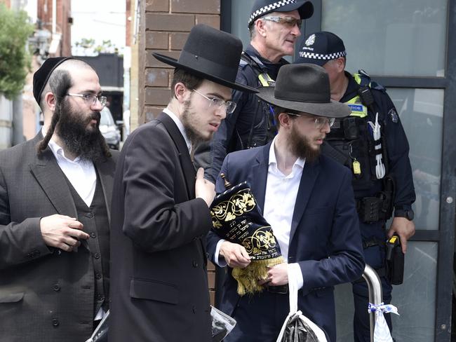 MELBOURNE, AUSTRALIA. NewsWire Photos. 6 DECEMBER 2024. Synagogue members remove religious material from Adass Israel synagogue at Ripponlea after an overnight fire. Picture: NewsWire /Andrew Henshaw