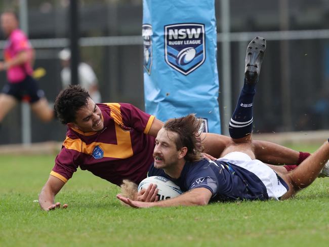 Newcastle’s James Bradley scores a try. Picture: Sue Graham