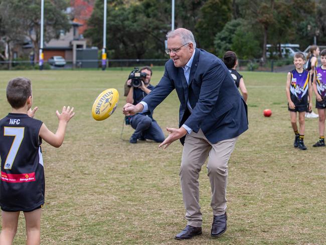 Prime Minister Scott Morrison visits Norwood Sporting Club in Ringwood, Victoria. to meet some of the junior players and join in some AFL footy drills. Picture: Jason Edwards