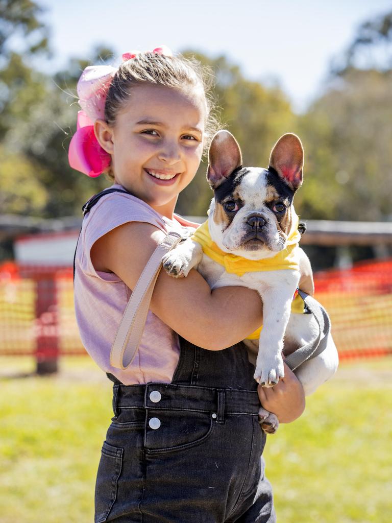 Sienna de Waal, 9, with Frankie at Paws at the Park held at Mudgeeraba showground on Sunday. Picture: Jerad Williams