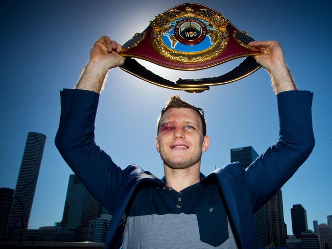 Newly crowned WBO welterweight champion Jeff Horn poses with his belt. Picture: AFP