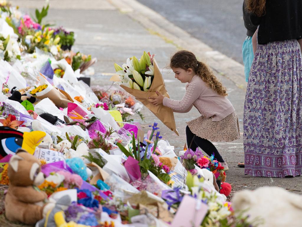 Mourners pay tribute to the children who died after gust of wind swept away a jumping castle at Hillcrest Primary School Devonport Tasmania. Picture: Jason Edwards