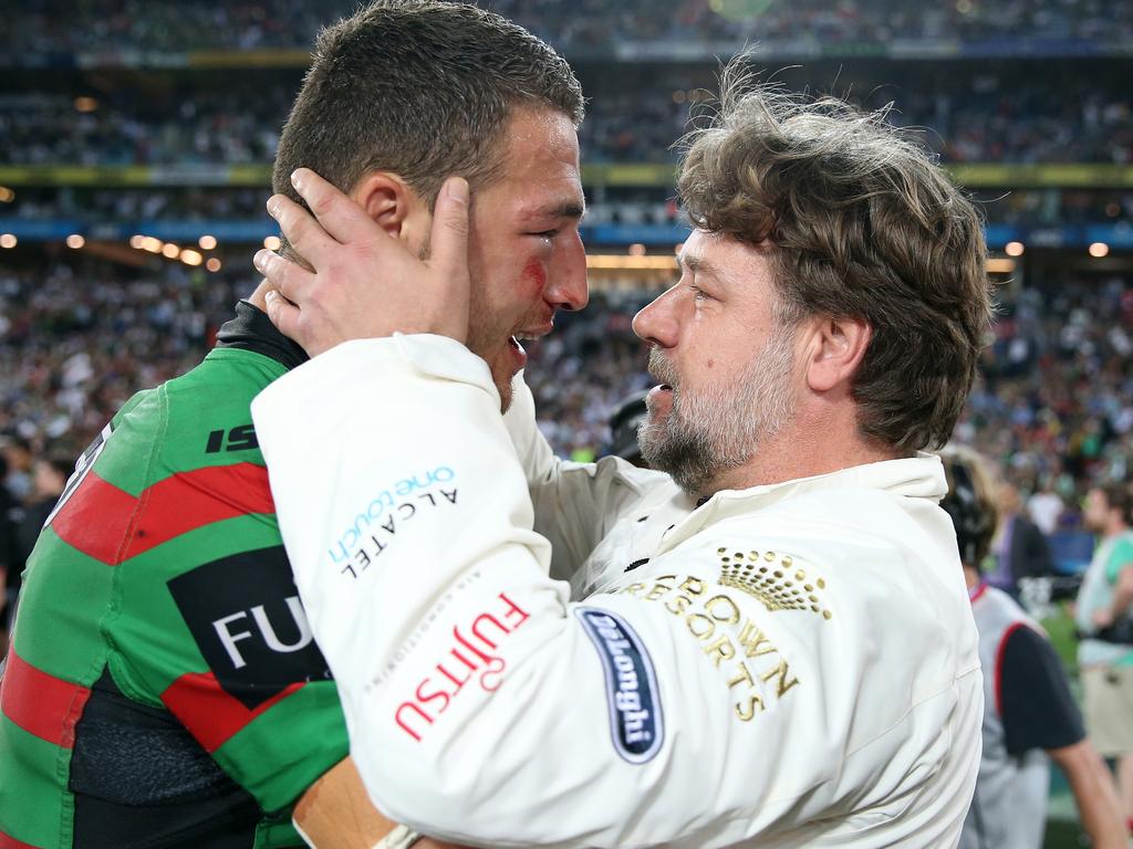 Russell Crowe celebrates the 2014 grand final win with Sam Burgess.