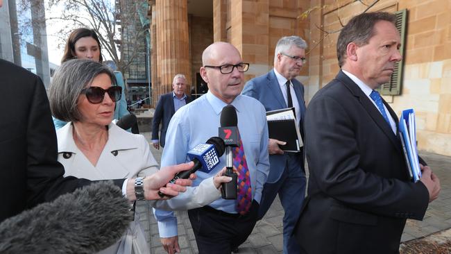 Harrap, his solicitor Craig Caldicott and barrister David Edwardson QC leave court following his first appearance. Picture: Tait Schmaal.