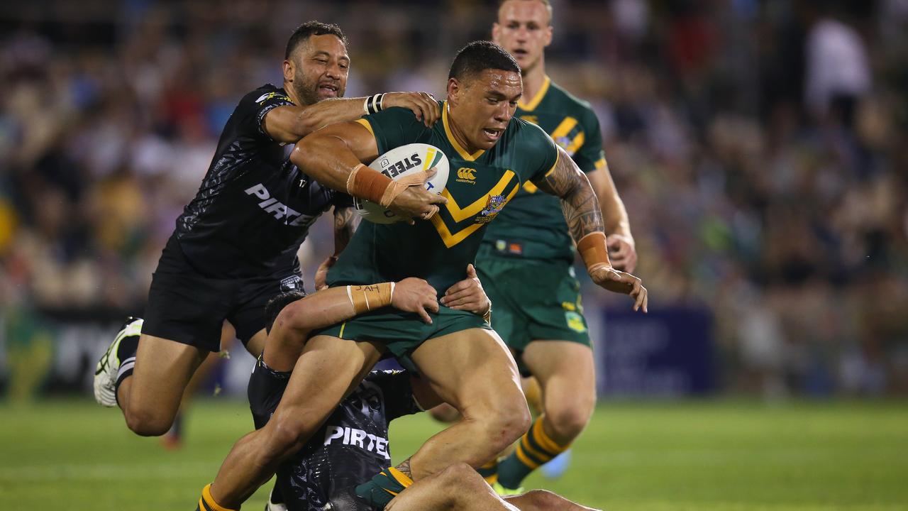 Tyson Frizell of Australia is tackled by the Kiwis