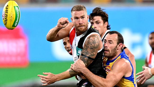 St Kilda’s Dean Kent gets a handball away against the Eagles as West Coast stormed home to swamp the Saints in the final 10 minutes at the Gabba. Picture: Getty Images