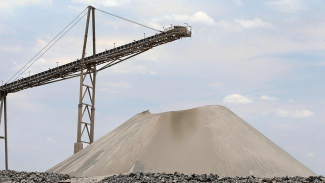 Lithium ore on stockpiles at Pilbara Minerals’ Pilgangoora mine in Western Australia. Picture: Colin Murty