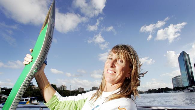 Glynis Nunn-Cearns holding the Queen's Baton ahead of the Melbourne Commonwealth Games in 2006.