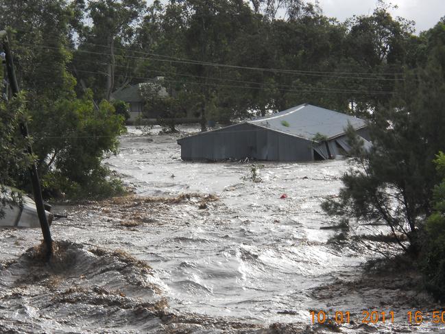 Floods surge through the Lockyer Valley in January 2011. Picture: Jack Tran