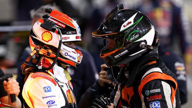 Anton De Pasquale driver of the #11 Shell V-Power Racing Ford Mustang celebrates winning race 20 with third place Brodie Kostecki driver of the #99 Erebus Boost Mobile Racing Holden Commodore ZB during the Sydney SuperNight which is part of the 2021 Supercars Championship, at Sydney Motorsport Park, on October 30. Picture: Getty