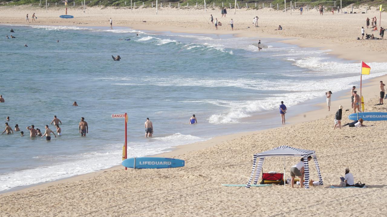 Swimmers ordered out in wild scenes