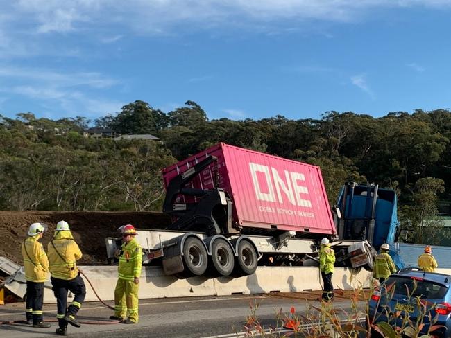 A semi-trailer left Mona Vale Rd at Ingleside and crashed over a concrete safety barrier at a roadworks construction zone. Picture: Ingleside RFS