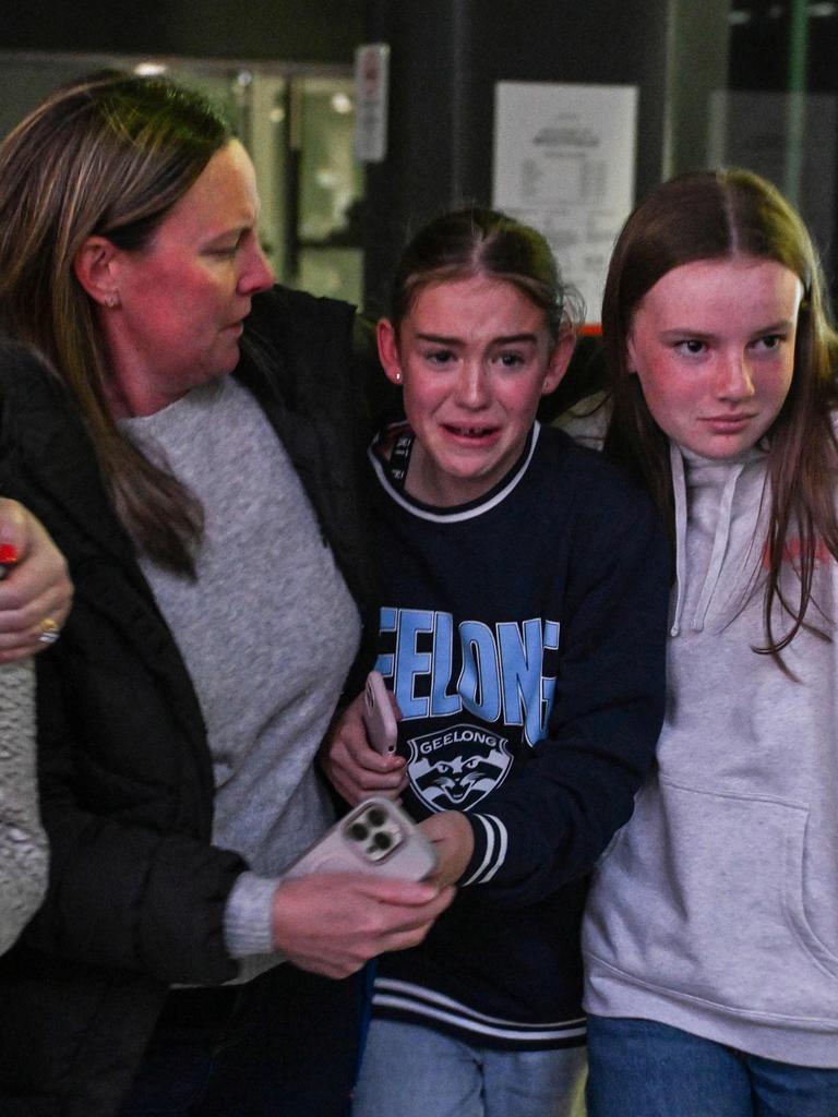 Distressed customers leave the Westfield Marion where armed gangs were reported inside. Picture: NewsWire / Brenton Edwards