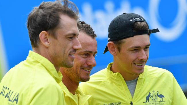 John Millman (left) and Alex de Minaur flank Australia’s Davis Cup captain Lleyton Hewitt Picture: AAP