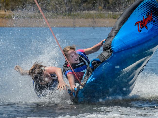 Grace Price and Gracie Tomlin enjoy the easing of coronavirus restrictions at Lake Eppalock Holiday Park.