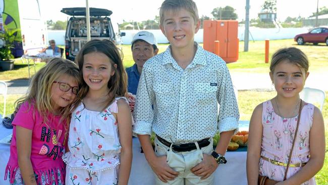 Pip Thiele, Evie Hevelt, Josh Williams and Maya Williams admire Andrew Hao&#39;s carved fruit display. Picture: Jann Houley