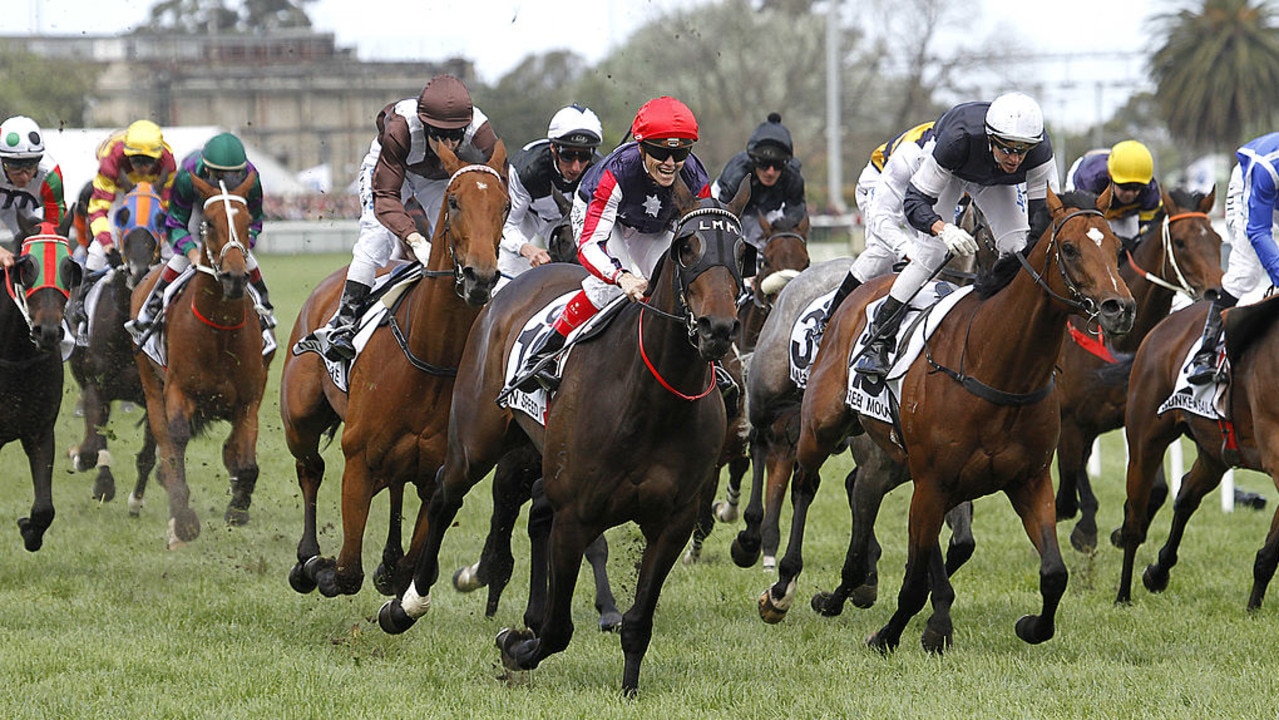 MELBOURNE, AUSTRALIA - OCTOBER 15:  Jockey Craig Williams (red cap) rides Southern Speed to win the Caulfield Cup at Caulfield Racecourse on October 15, 2011 in Melbourne, Australia.  (Photo by Luis Ascui/Getty Images)