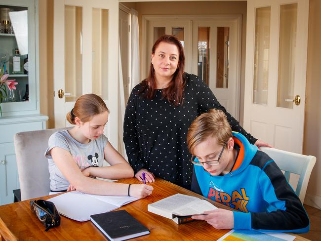 Rebecca Reid with her children Callum 14, Mykala 13 on September 3, 2020 in Hahndorf.  Rebecca hasn't seen her WA FIFO worker husband in months because of border restrictions. Picture Matt Turner.