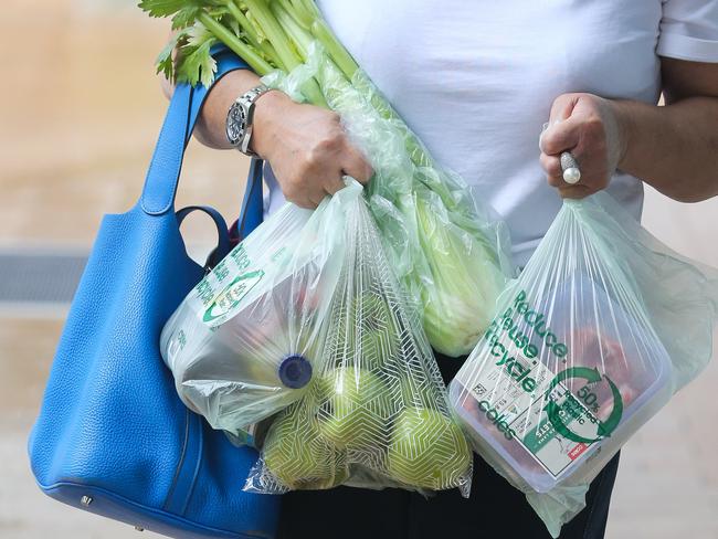 SYDNEY, AUSTRALIA -  Newswire Photos MARCH 14 2023 - A member of the public is seen buying produce and groceries in Sydney as the Cost of living continues to rise. Picture: NCA Newswire / Gaye Gerard.