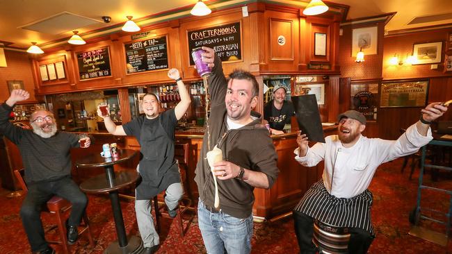 Staff at the Charles Dickens pub in Melbourne celebtate emerging from lockdown, from left: Mark Harrison (part owner), chef Joseph Tan, John Davie (part owner), manager Eric Fleming and head chef Joseph Weir. Picture: Alex Coppel.