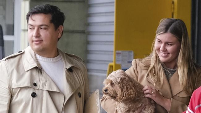 Brittany Higgins and David Sharaz with their cavoodle Kingston at Bordeaux-Merignac airport after their cat and dog cleared quarantine. Picture: Jacquelin Magnay