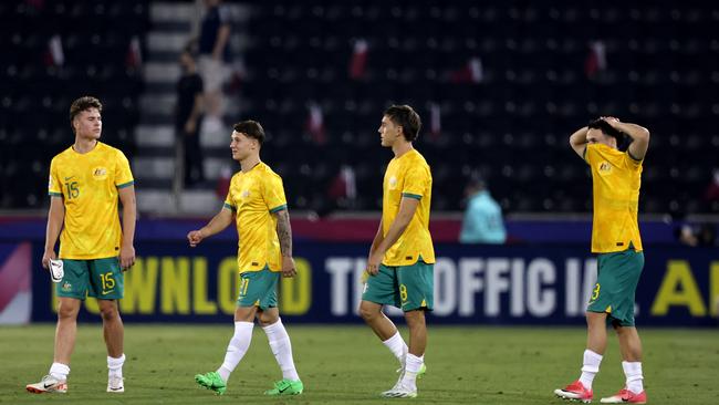 Disappointed Olyroos players ponder their side’s failure to qualify for the Olympics. Picture: Mohamed Farag/Getty Images