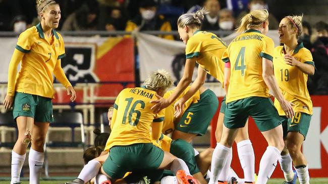 Australian players celebrate their first goal scored by Lisa De Vanna during the AFC Women's Olympic Final Qualification Round match between Australia and Japan.