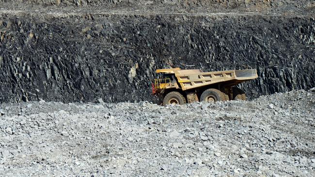 A dump truck drives along an access ramp to a mine floor at the Bald Hill lithium mine site, co-owned by Tawana Resources Ltd. and Alliance Mineral Assets Ltd., outside of Widgiemooltha, Australia, on Monday, Aug. 6, 2018. Australias newest lithium exporter Tawana is in talks with potential customers over expansion of its Bald Hill mine and sees no risk of an oversupply that would send prices lower. Photographer: Carla Gottgens/Bloomberg via Getty Images