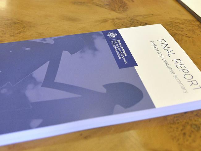 In this photo provided by the Australian Government Royal Commission, the volumes of the Final Report of the Royal Commission into Institutional Responses to Child Sexual Abuse sit on a table at Government House, in Canberra, Dec. 15, 2017. The commission delivered its final 17-volume report and 189 recommendations following a wide-ranging investigation. (Jeremy Piper/Australian Government Royal Commission via AP)