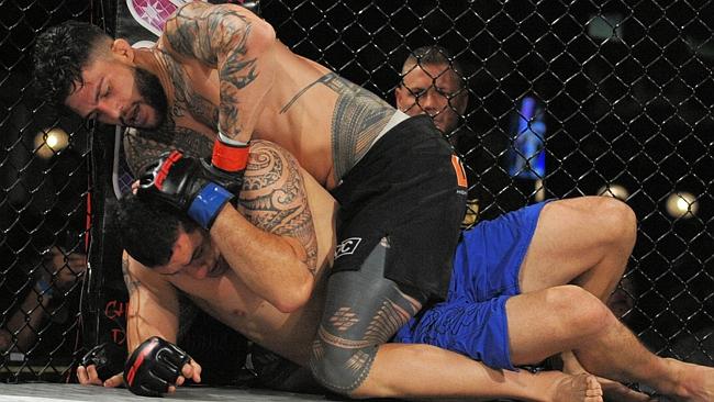 Tyson Pedro lays into Kiwi striker Steven Warby. Picture: Supplied/Terry Vorg
