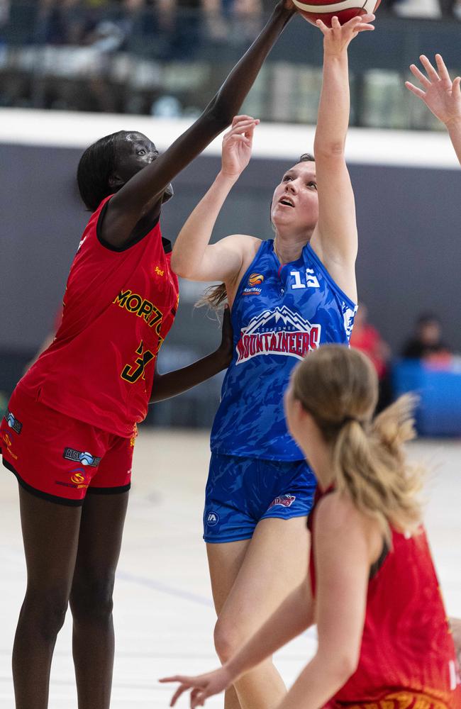 Lucy Topp of Toowoomba Mountaineers defended by Ayen Akech (left) of Moreton Bay Suns in SQJBC U18 Women round 3 basketball at Toowoomba Grammar School, Sunday, October 20, 2024. Picture: Kevin Farmer