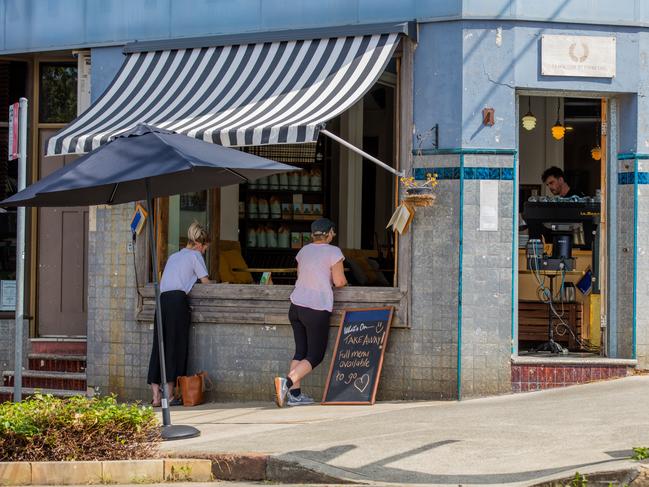 25/3/2020 - Annandale, Sydney, AustraliaPeople line up to get takeaway coffee and lunch from The Little Marionette Cafe, Annandale, NSW.Picture: Adrian Fowler/ NEWS360