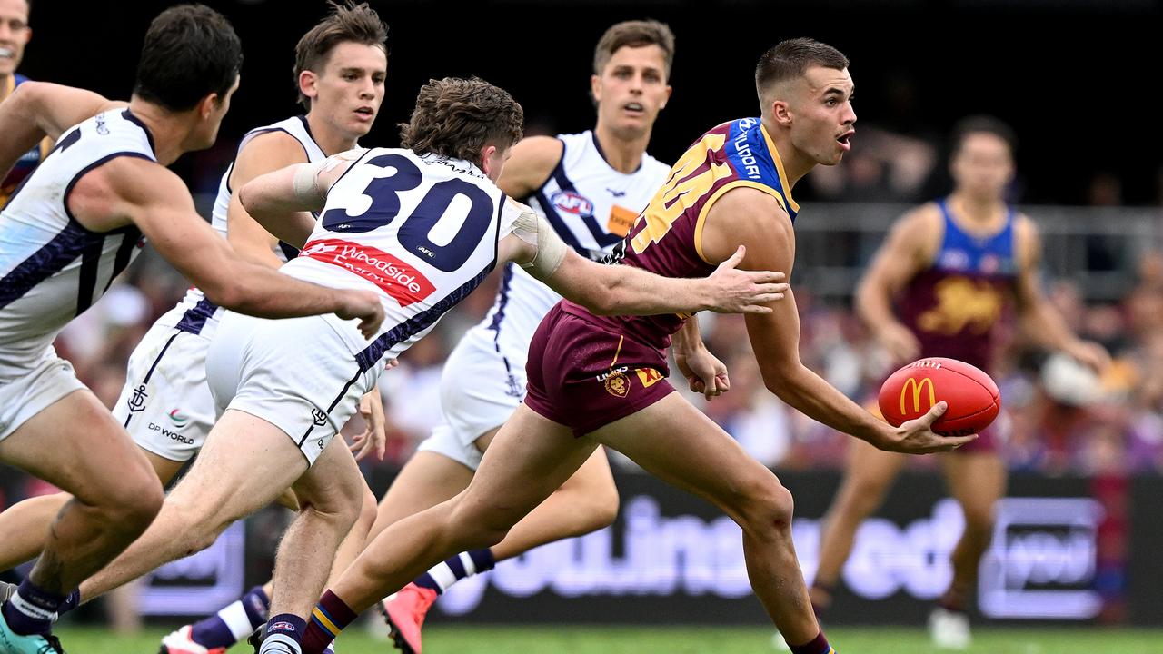 BRISBANE, AUSTRALIA – APRIL 29: Darcy Wilmot of the Lions gets a handball away during the round seven AFL match between Brisbane Lions and Fremantle Dockers at The Gabba, on April 29, 2023, in Brisbane, Australia. (Photo by Bradley Kanaris/Getty Images)