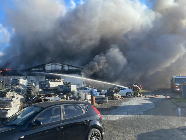 One firefighter was taken to hospital. Picture: Queensland Ambulance Service