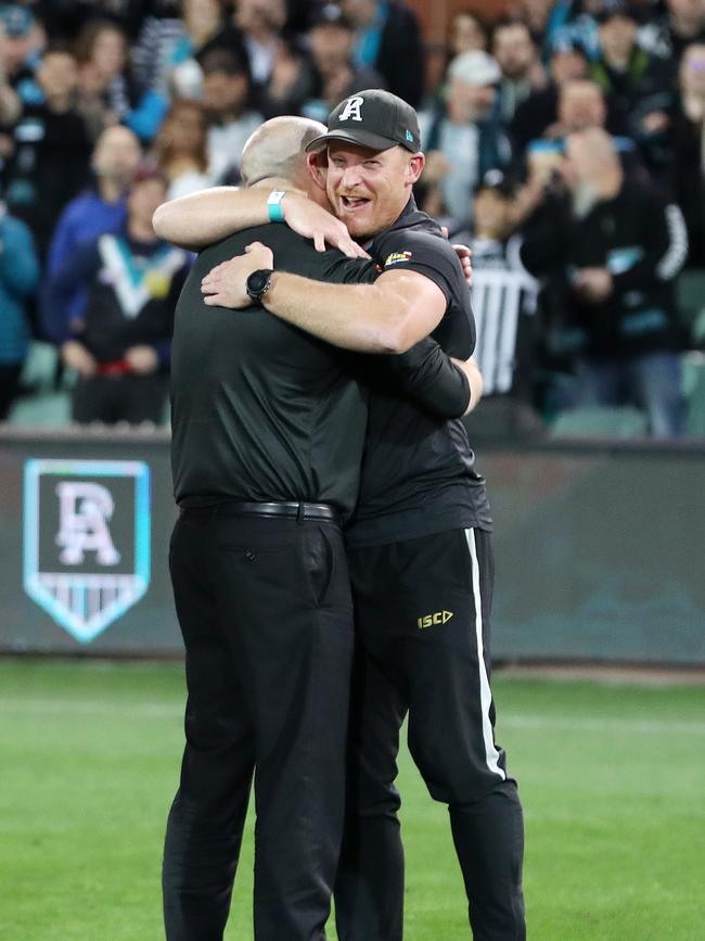 Ken Hinkley hugs Michael Voss. Picture: Sarah Reed