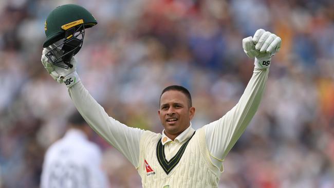 Usman Khawaja raises his arms in triumph after a superb century. Picture: Getty