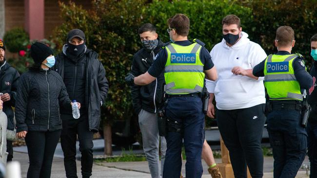 A heavy police presence as groups of people walk around the streets of Dandenong. Picture: Mark Stewart