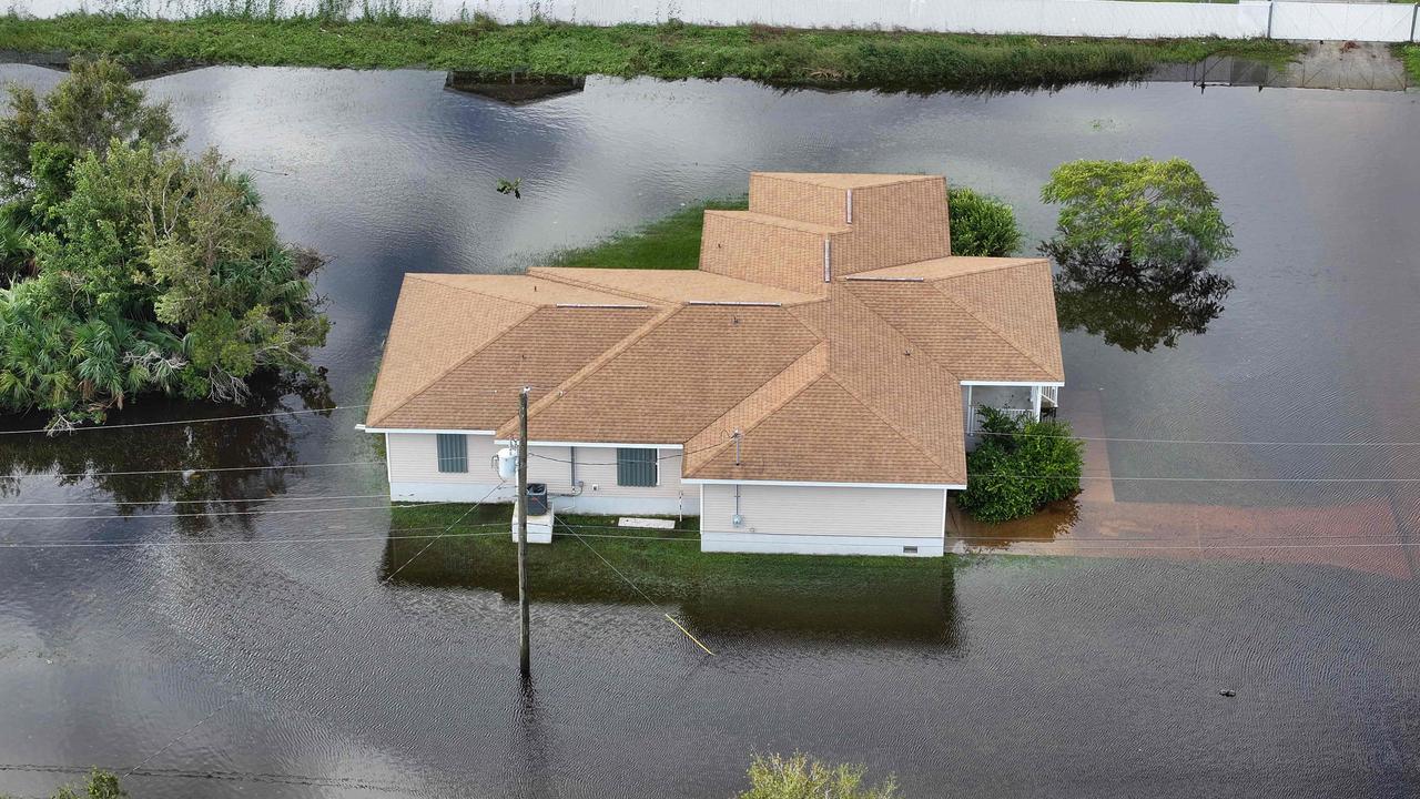 Flood waters inundate a neighbourhood after Hurricane Milton came ashore on October 10, 2024, in Punta Gorda, Florida. (Photo by JOE RAEDLE / GETTY IMAGES NORTH AMERICA / Getty Images via AFP)