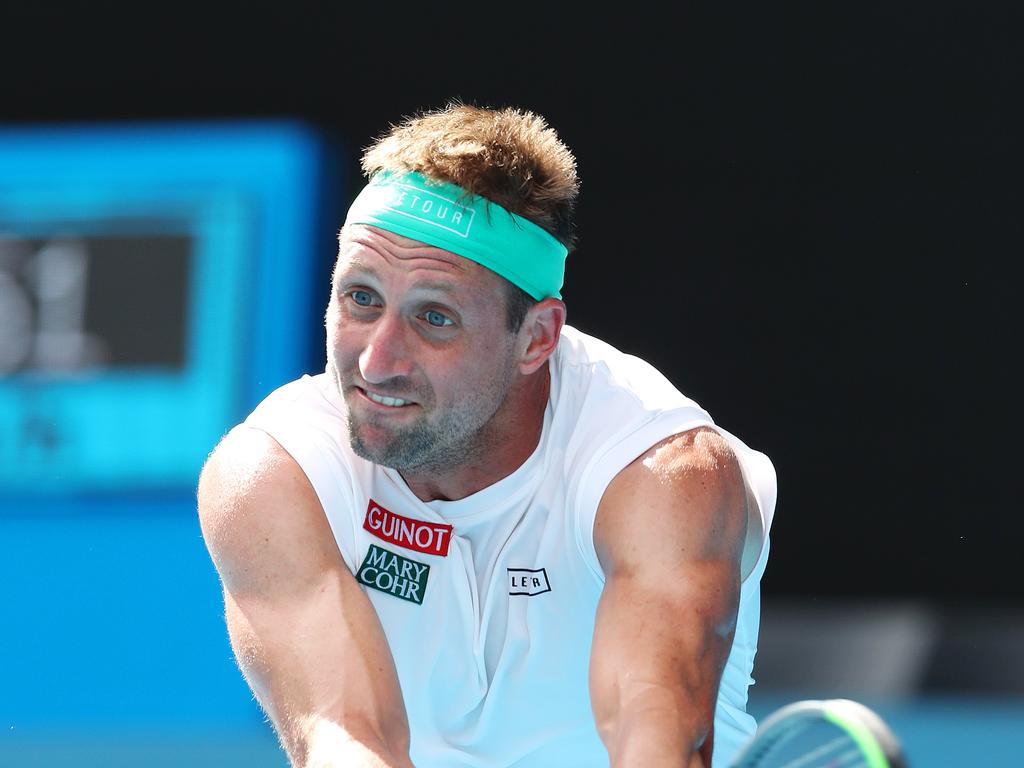 Tennys Sandgren in action against Roger Federer.