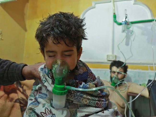 Syrian children and adults receive treatment for a suspected chemical attack at a makeshift clinic on the rebel-held Eastern Ghouta region. Picture: AFP