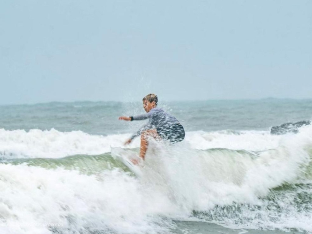 Levi Bissett surfing