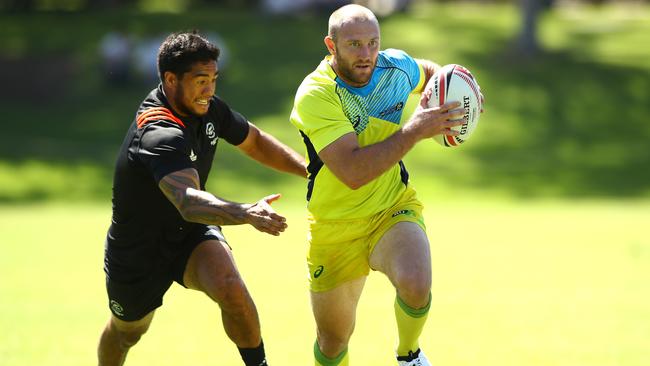 James Stannard of Australia runs the ball against New Zealand at Newington College.