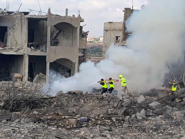 Lebanese defence workers extinguish a fire following an Israeli air raid in Shamaa in southern Lebanon. Picture: AFP