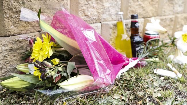 Flowers lay at the scene where a teenager riding a motorcycle was killed last night on Harbord Road, Claremont. Picture: Zak Simmonds