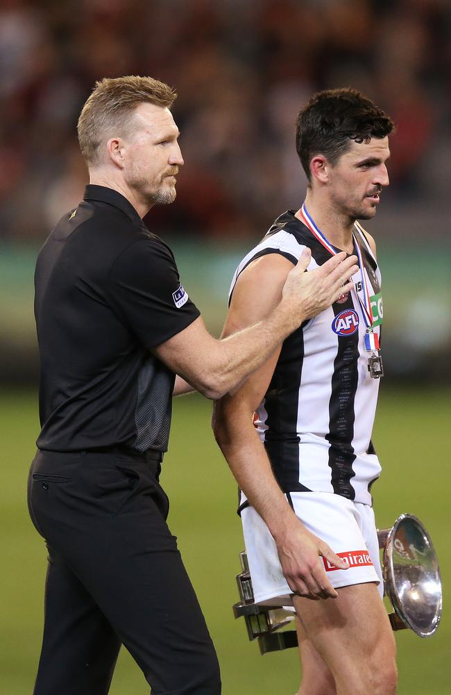 Magpies head coach Nathan Buckley walks off the MCG with Scott Pendlebury after he won the Anzac Day Medal in 2019. Picture: Michael Dodge/Getty Images.