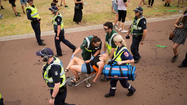 A reveller is wheeled away from the Stereosonic music festival, where two people died in the space of a week. Picture: Diimex