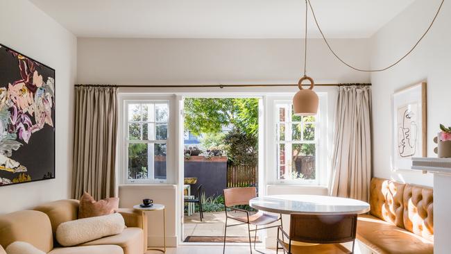 Heatherly Design founder and director Georgie Leckey applied her design know-how to renovating her small bolthole in Melbourne's Toorak. Her favourite space is the dining nook with banquette, which Georgie adapted from a chesterfield bedhead into a built-in leather bench seat. Picture: supplied.