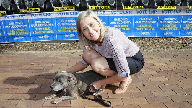 Susan Lamb poses with her dog Bear at Dakabin State High School on election day. (AAP Image/Claudia Baxter)